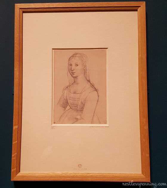 A young woman, half-length, seated, painting by Raphael